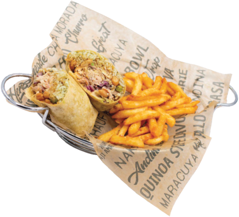 A metal basket lined with printed paper holds a halved burrito filled with chicken, vegetables, and sauce, served alongside a portion of seasoned curly fries.