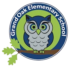 Logo of Grand Oak Elementary School featuring a blue and gray owl with green eyes sitting on a branch with green leaves, all inside a blue and green circular border with the school's name.